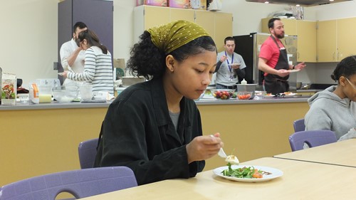 A Slow Food Movement Student Enjoys Her Caprese Salad