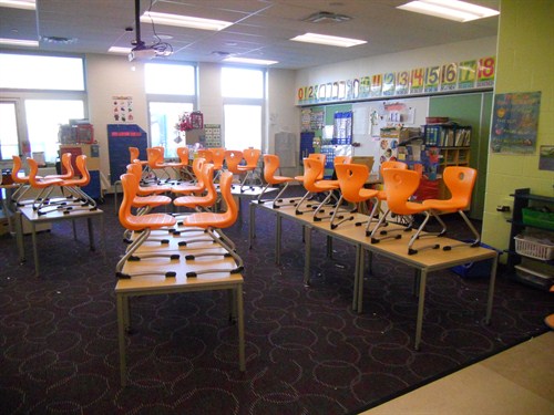 photo of chairs stacked on tables in kindergarten classroom