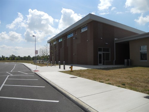 photo of back of building where buses pick up and drop off students. 