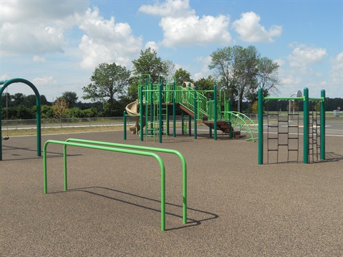 front playground showing equipment for students to play on. 