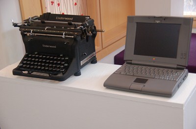 photo of old typewriter and laptop.