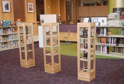 photo of three display cases which were built by our STEM high schools students. 