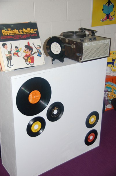 photo of vintage records with record player. 