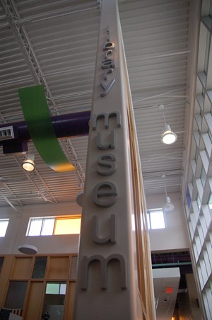 photo of library museum sign along the column of room. 