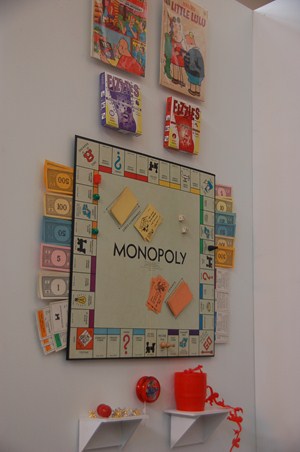 photo of vintage board games and more displayed on another section of library/museum. 
