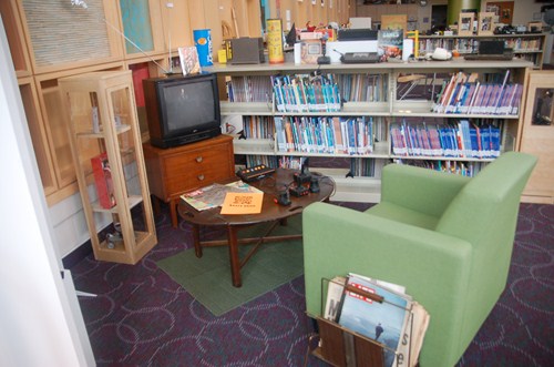 photo of chair, television with vintage Atari video game system. 