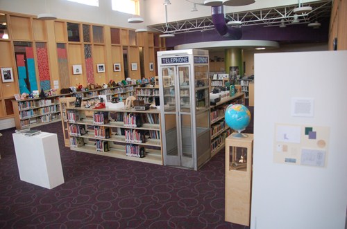 photo of library museum showing an actual telephone booth. 