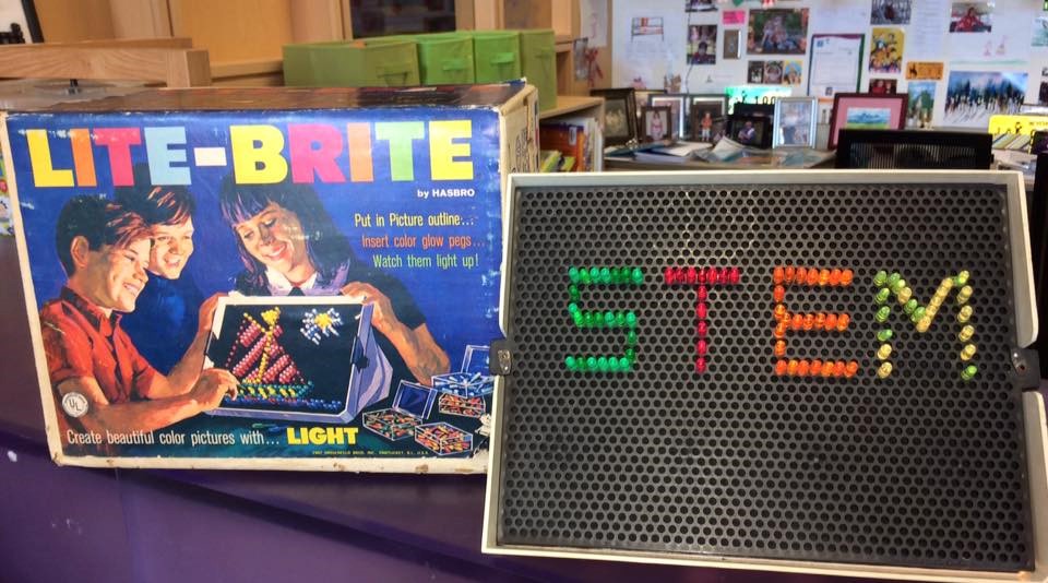 photo of vintage lite-brite toy with word STEM created on it. 