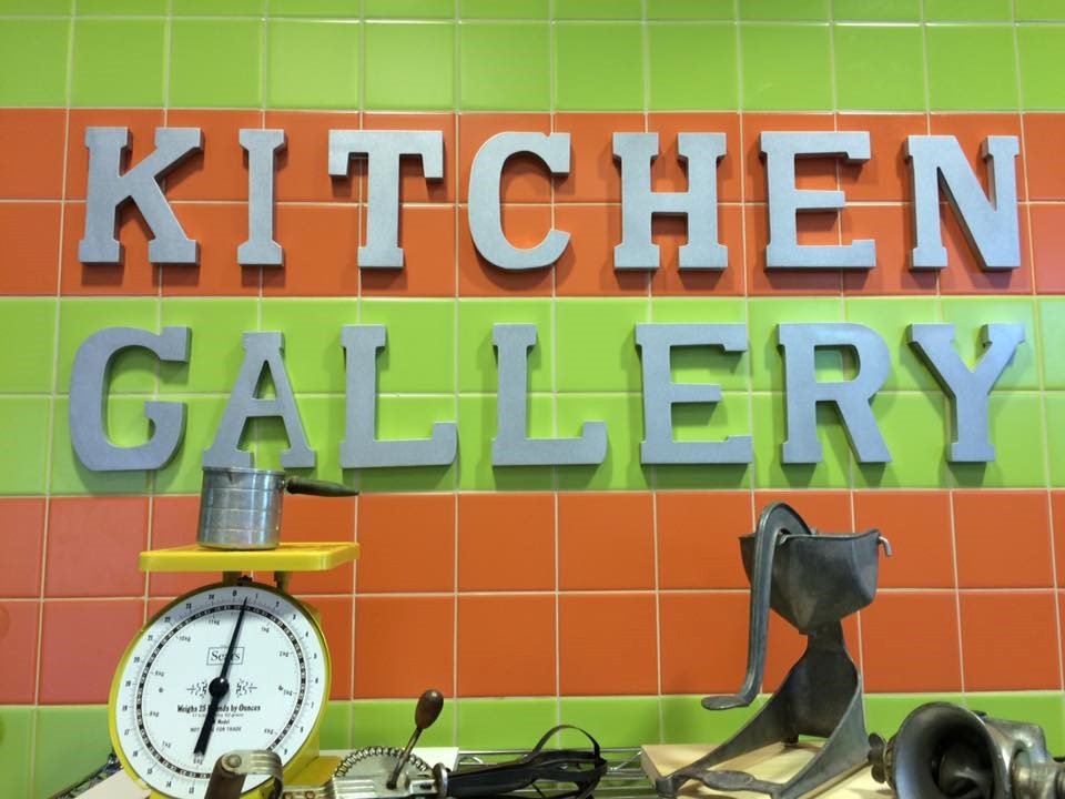 photo of the kitchen gallery sign posted on cafeteria wall. 