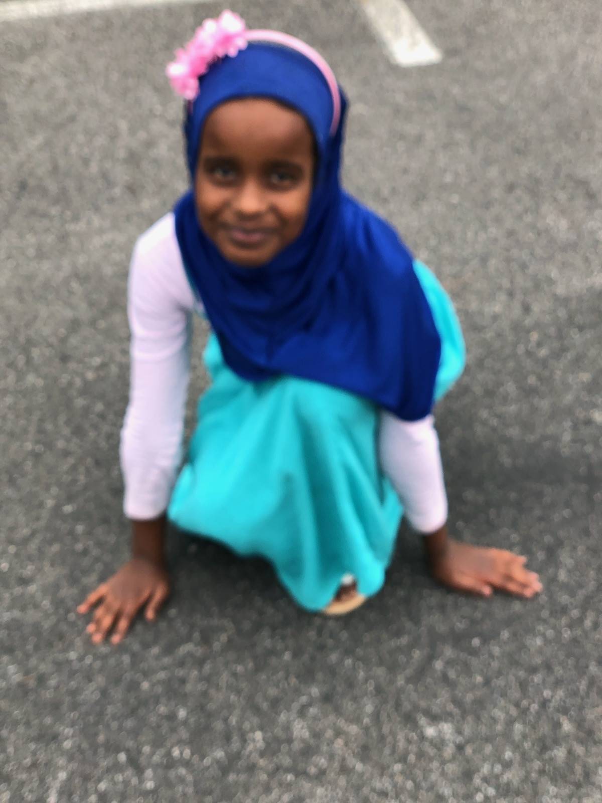 Girl in hijab out at recess