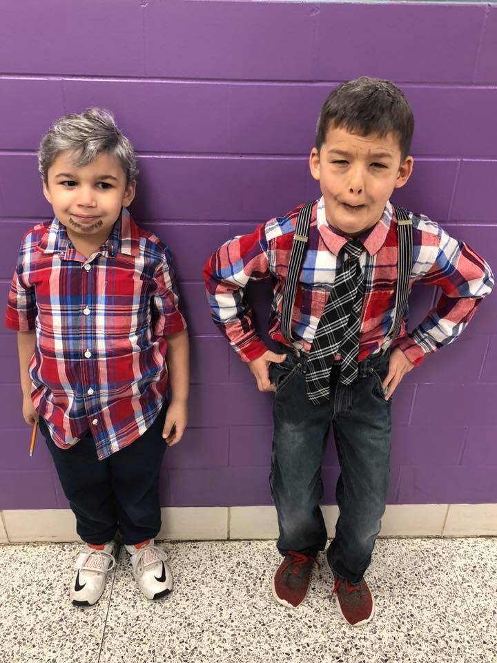Two students dressed as old men and matching
