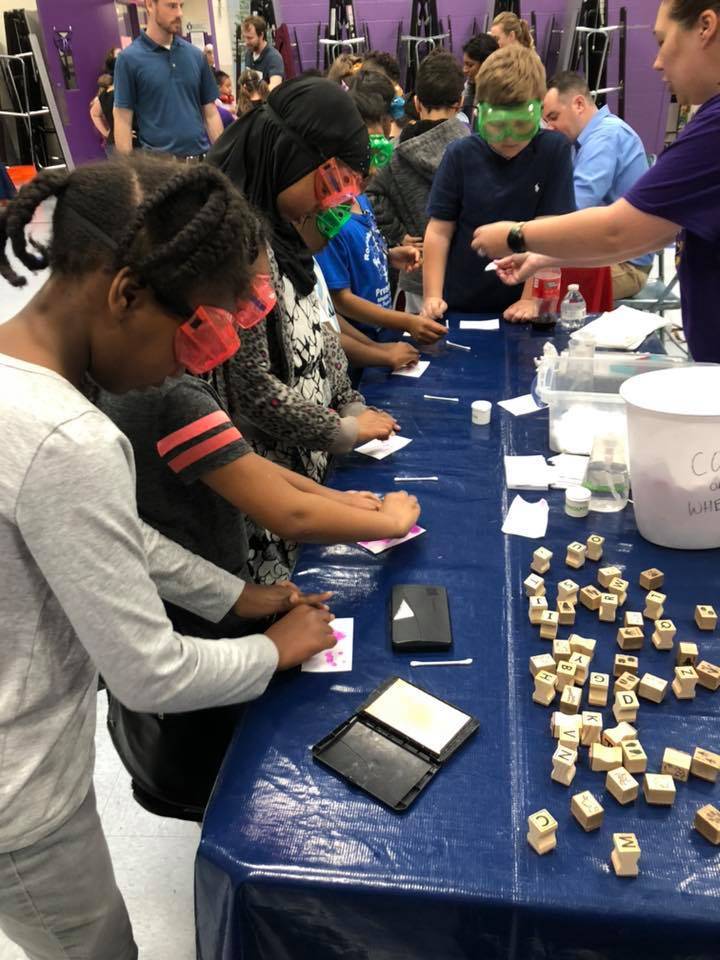 Rose Hill Students wearing googles working on a project
