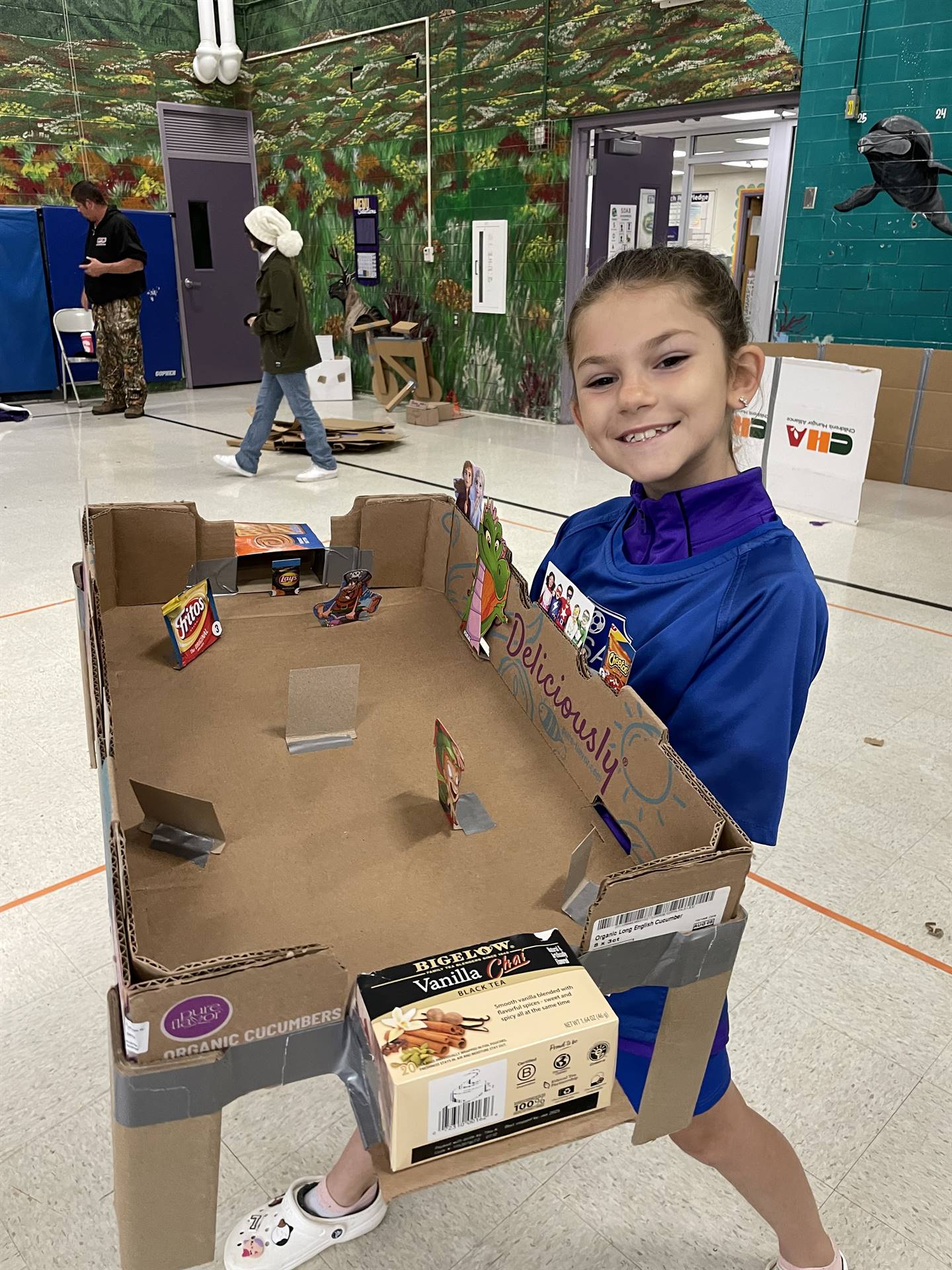 Firebird families in the gymnasium build with cardboard. 