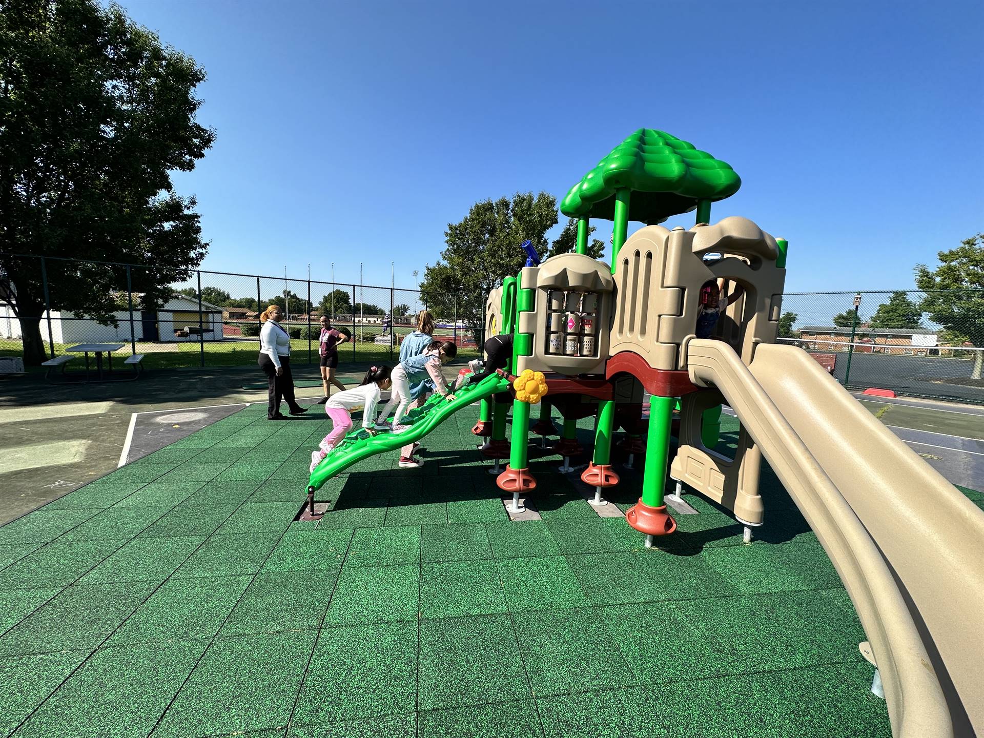 Kids on the playground for the first time. 