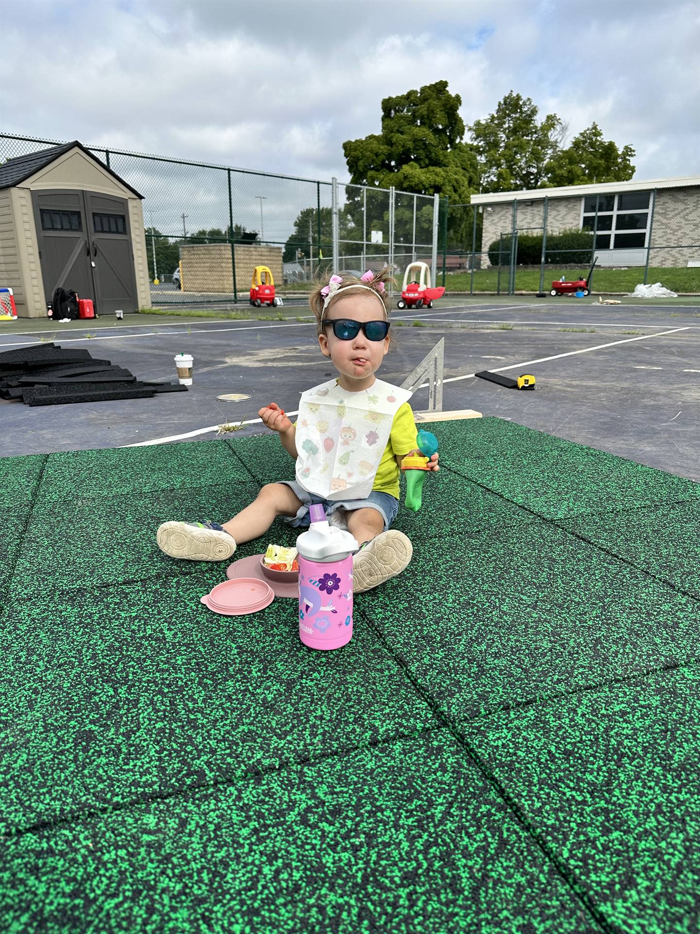 Staff working on the playground tiles