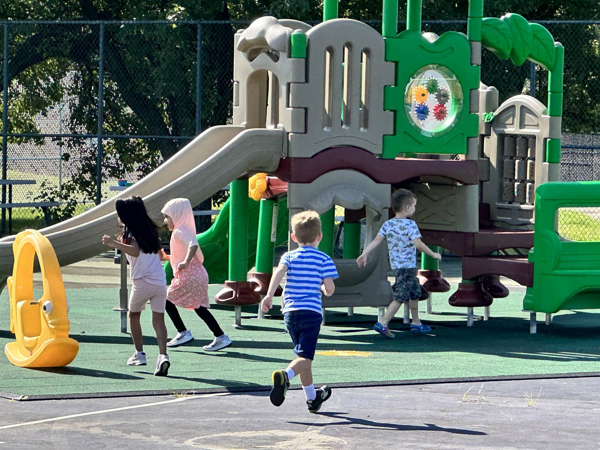 Kids on the playground for the first time. 