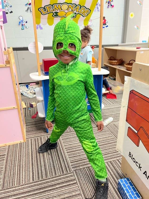 Little boy in green costume