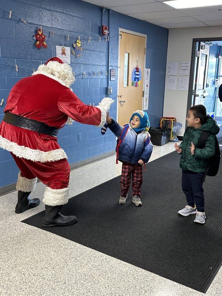 Santa Giving Kids High Fives