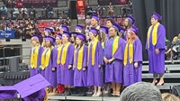 Senior members of the choir sing the school&#39;s alma mater