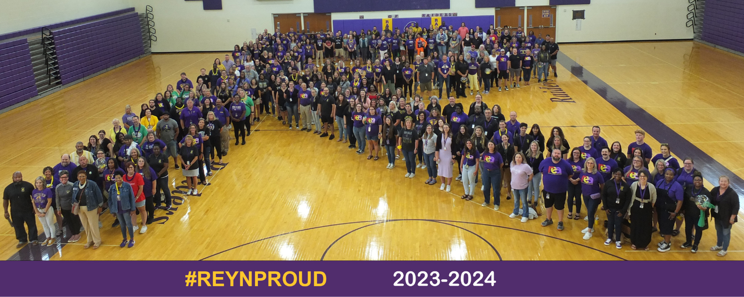 Reynoldsburg City Schools staff form the letter &#34;R&#34; for a group photo on the gym floor