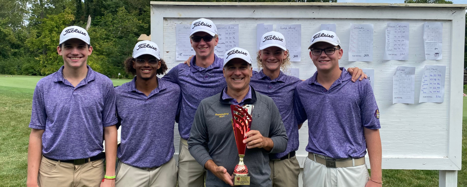 Members of the Reynoldsburg High School Varsity Golf Team stand with their coach, who is holding a trophy