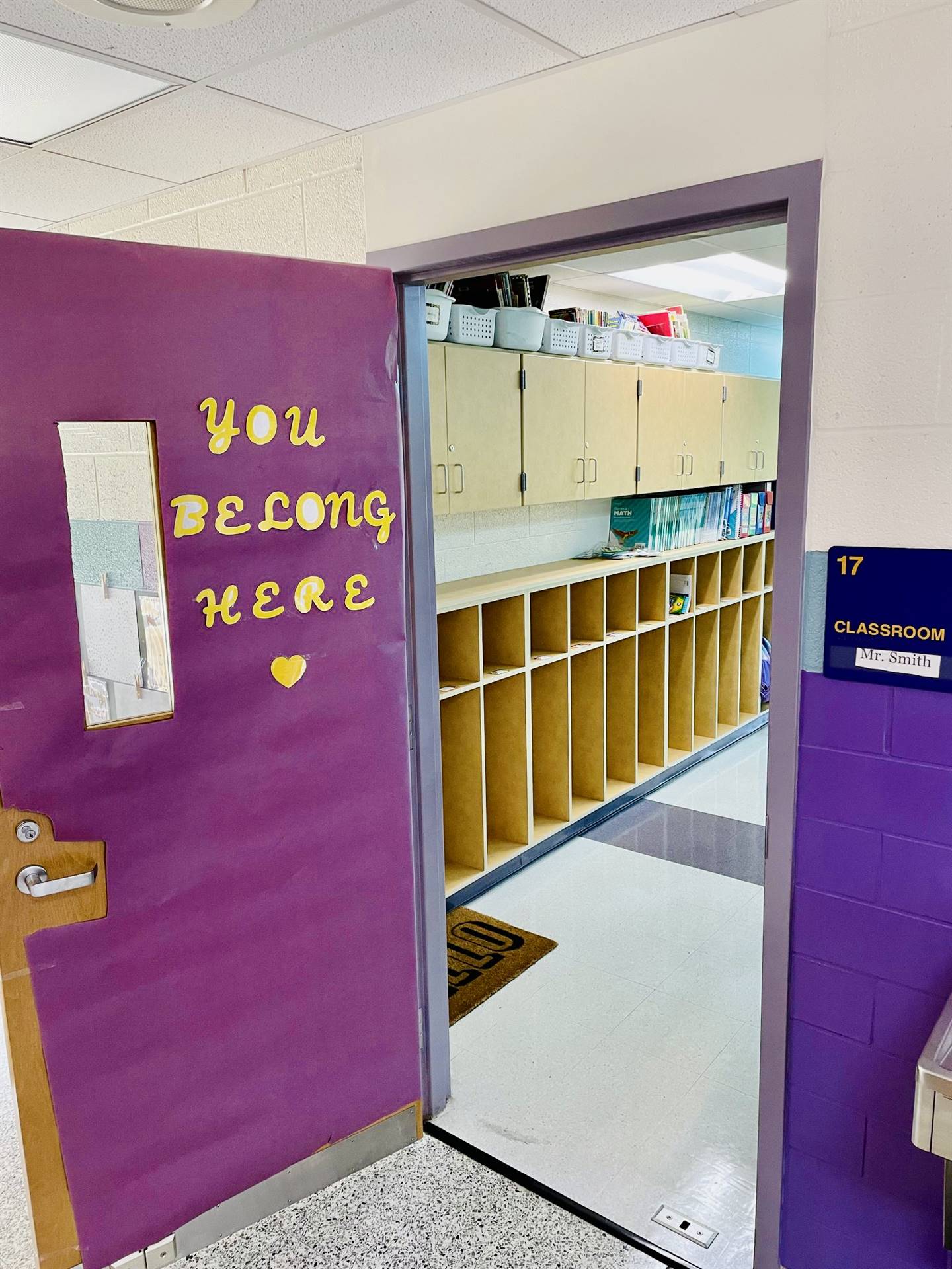 A classroom door decorated to say "You belong here."