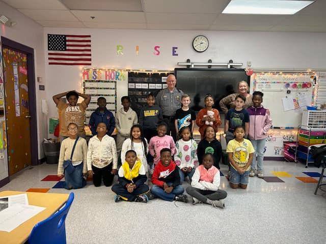 3rd Graders learning about different occupations of a State Highway Patrolman.