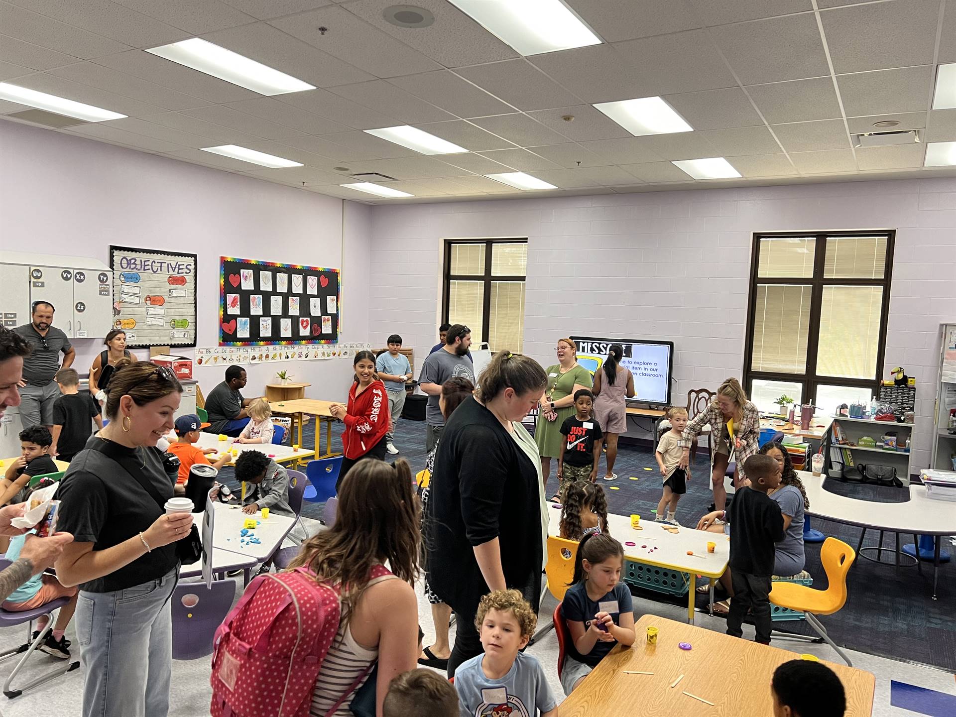 Kindergarten Families visit classrooms.
