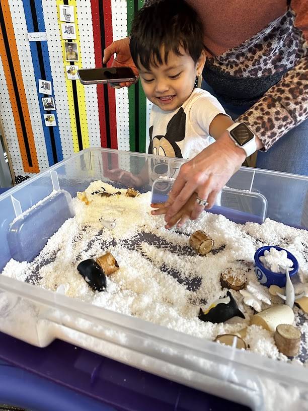 Student with a sensory bin