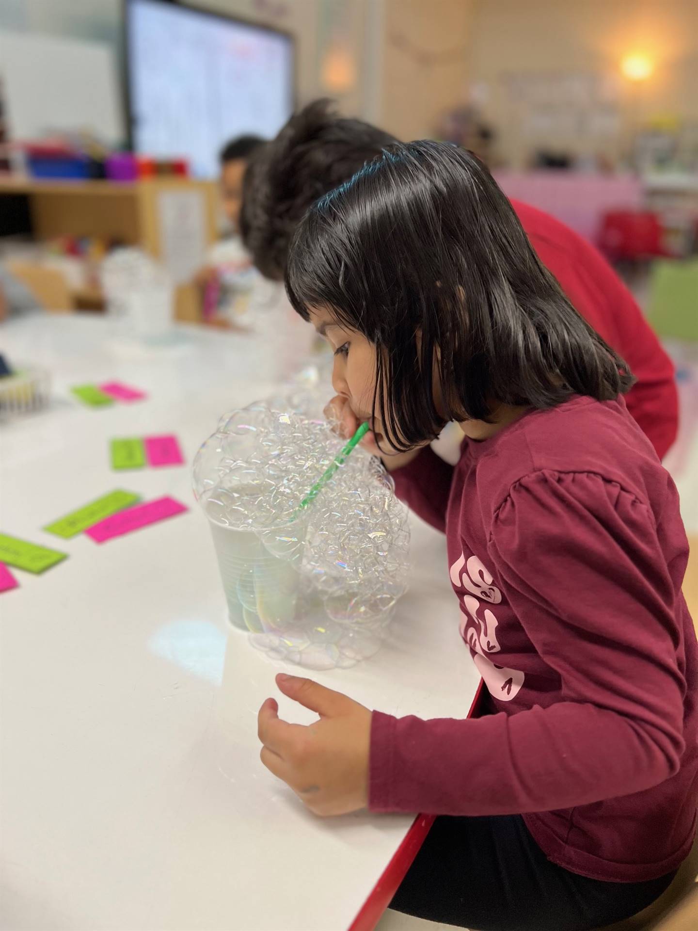 Student blowing bubbles