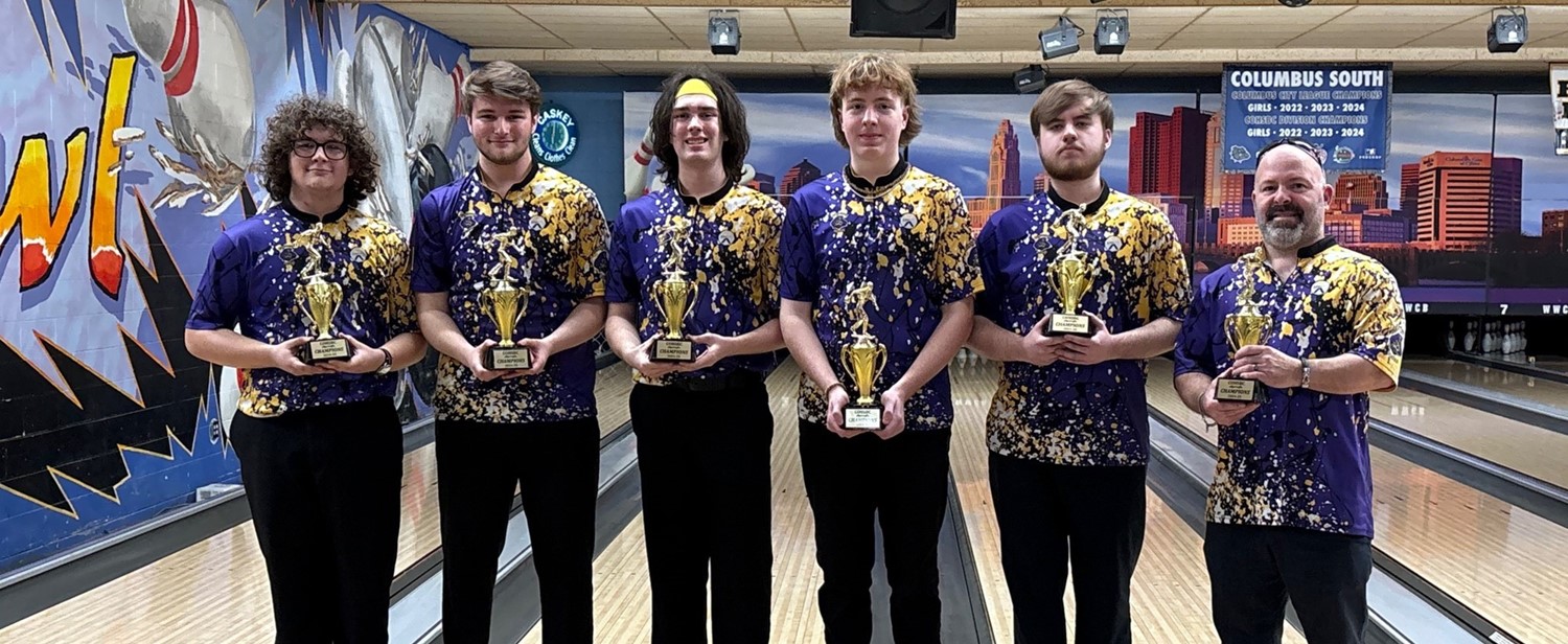 Boys bowling team posing with trophies