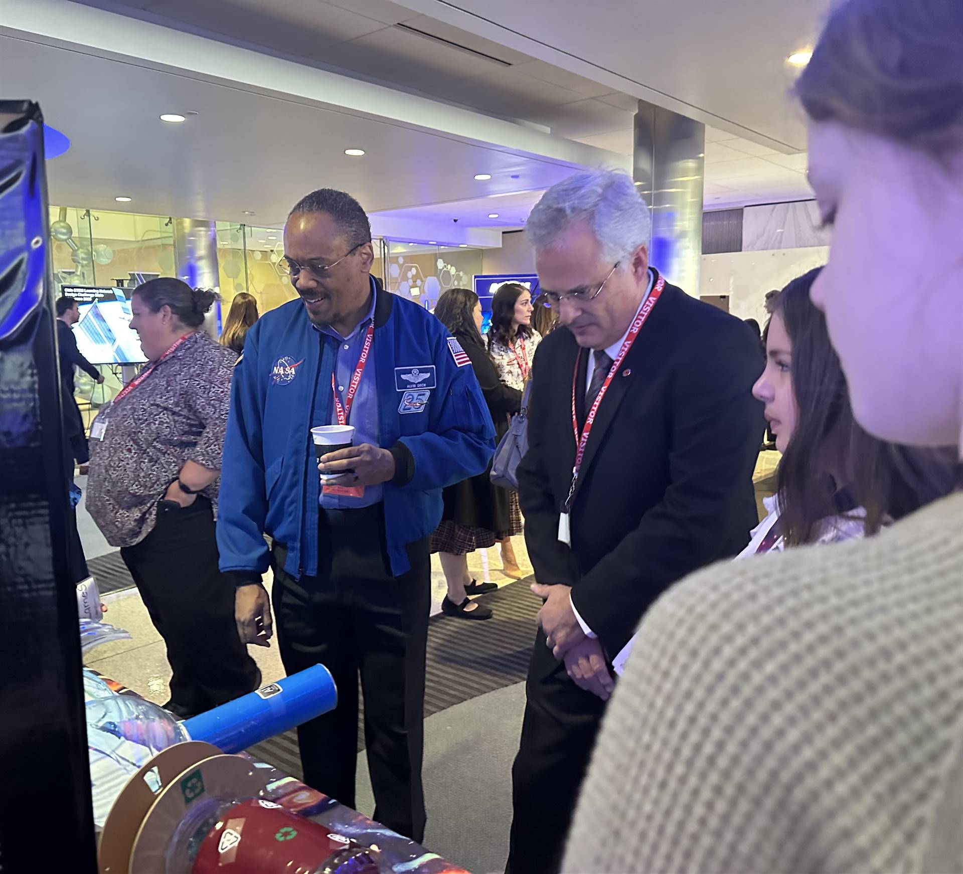 French run team of students present their innovation to Alvin Drew, NASA astronaut and Howard Green 