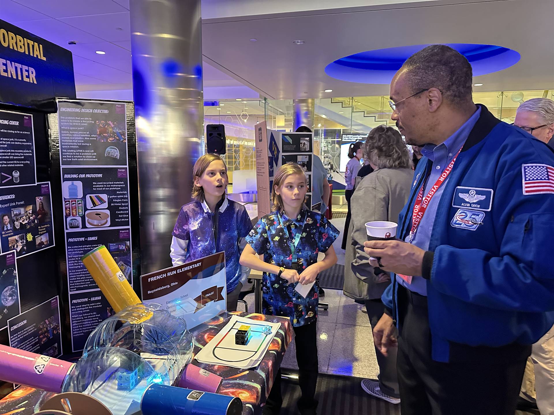 French run students getting feedback on their innovation from Alvin Drew NASA astronaut.