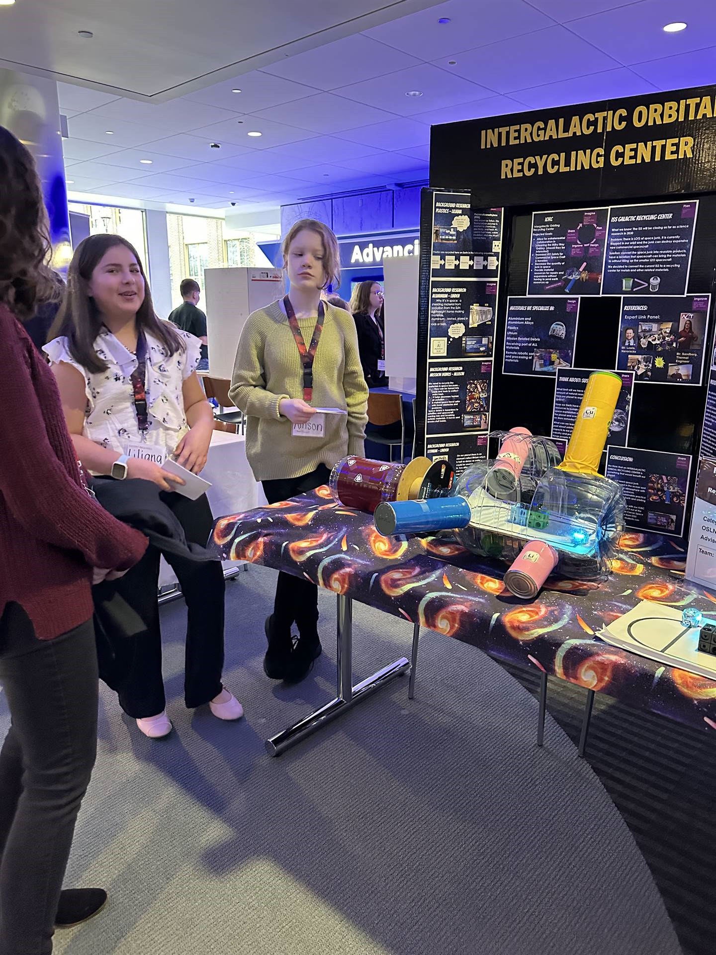French Run students presenting their prototype with robots simulating the recycling process in the I