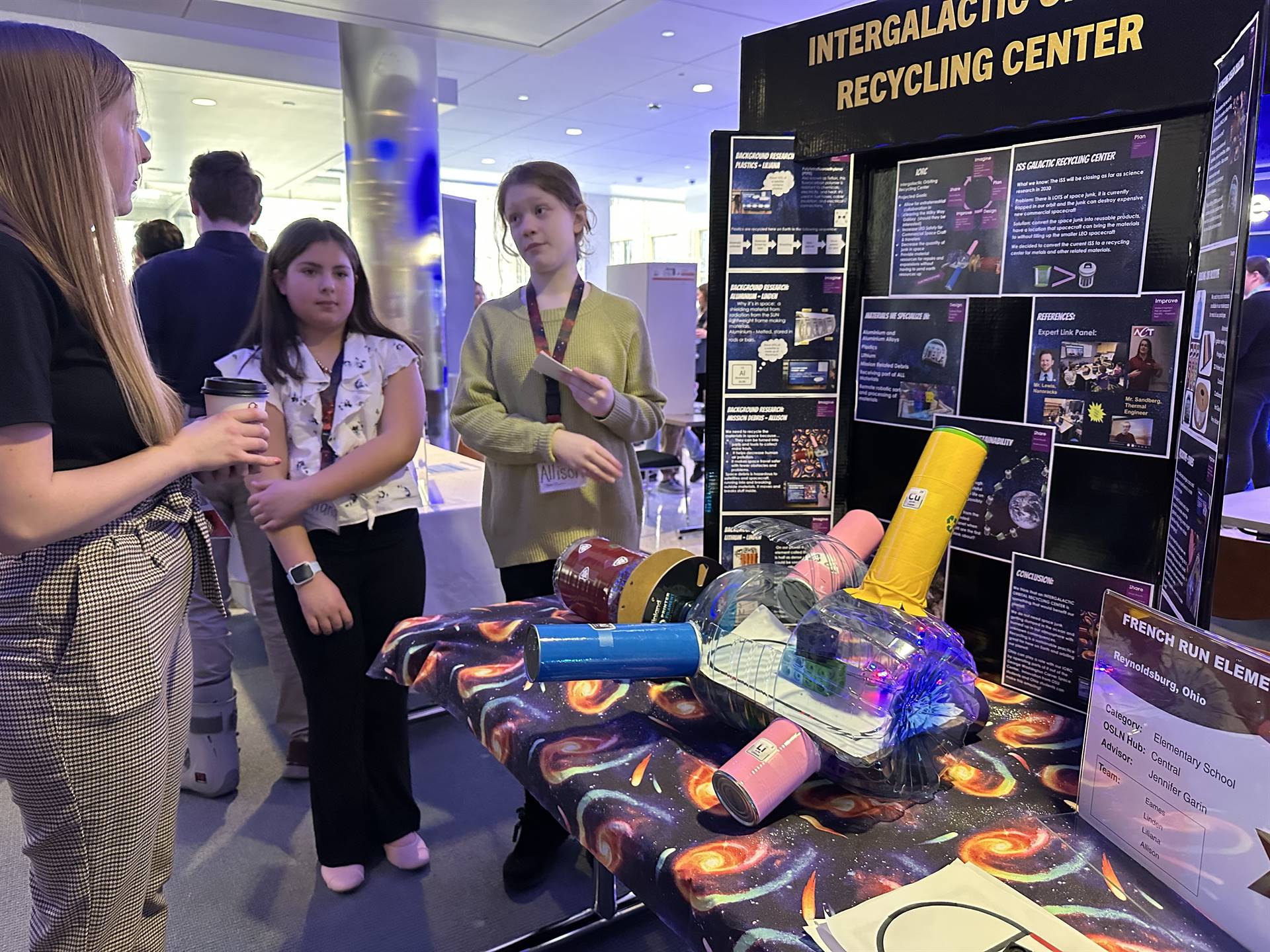 French Run students presenting their prototype with robots simulating the recycling process in the I