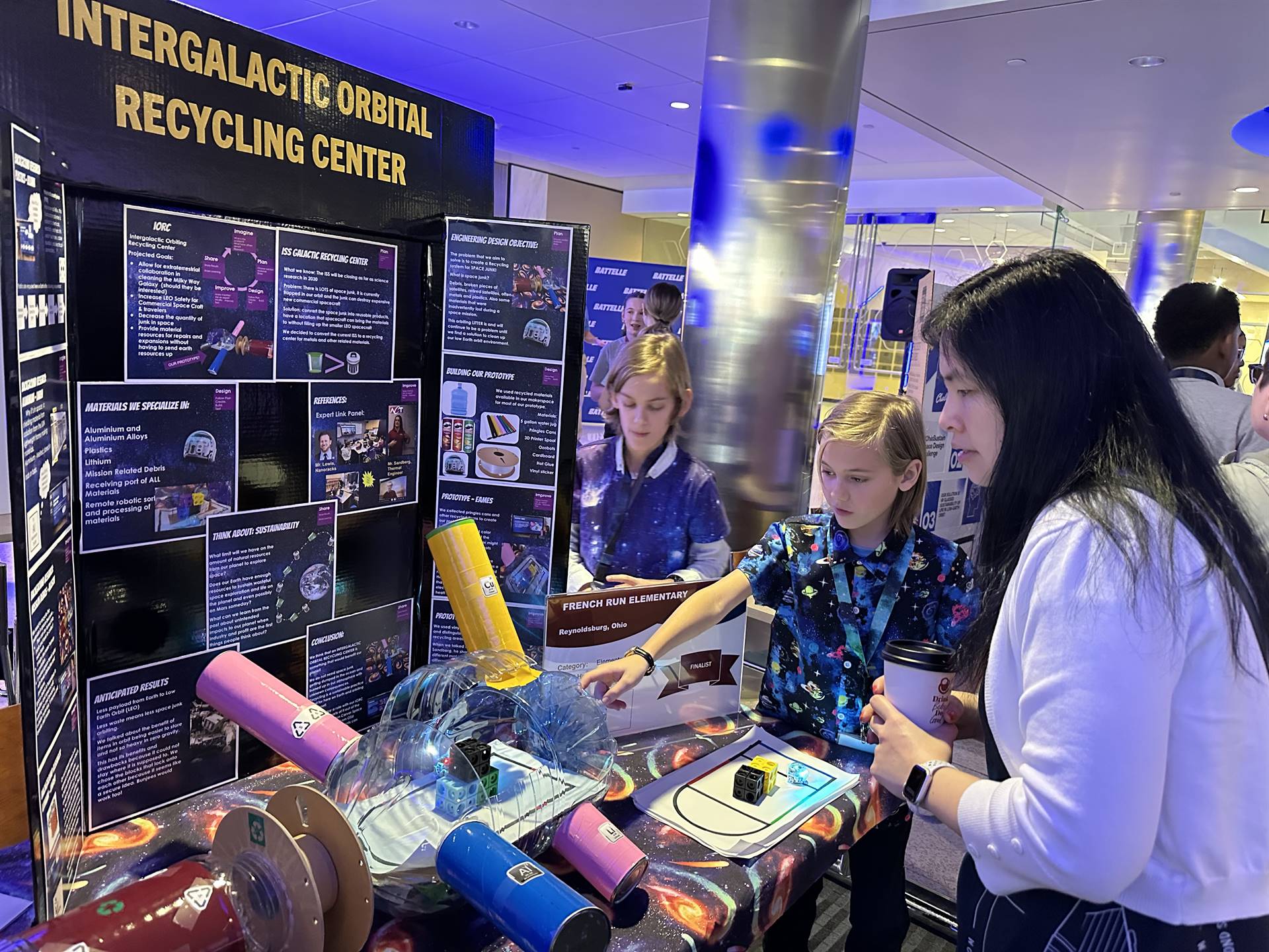 French Run students presenting their prototype with Ozobot robots simulating the recycling process i